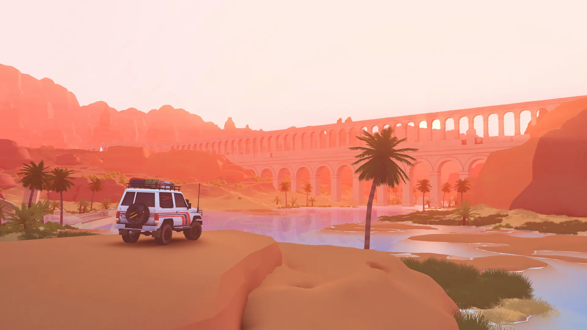 A white 4x4 by an oasis with a Roman aqueduct in over the hill