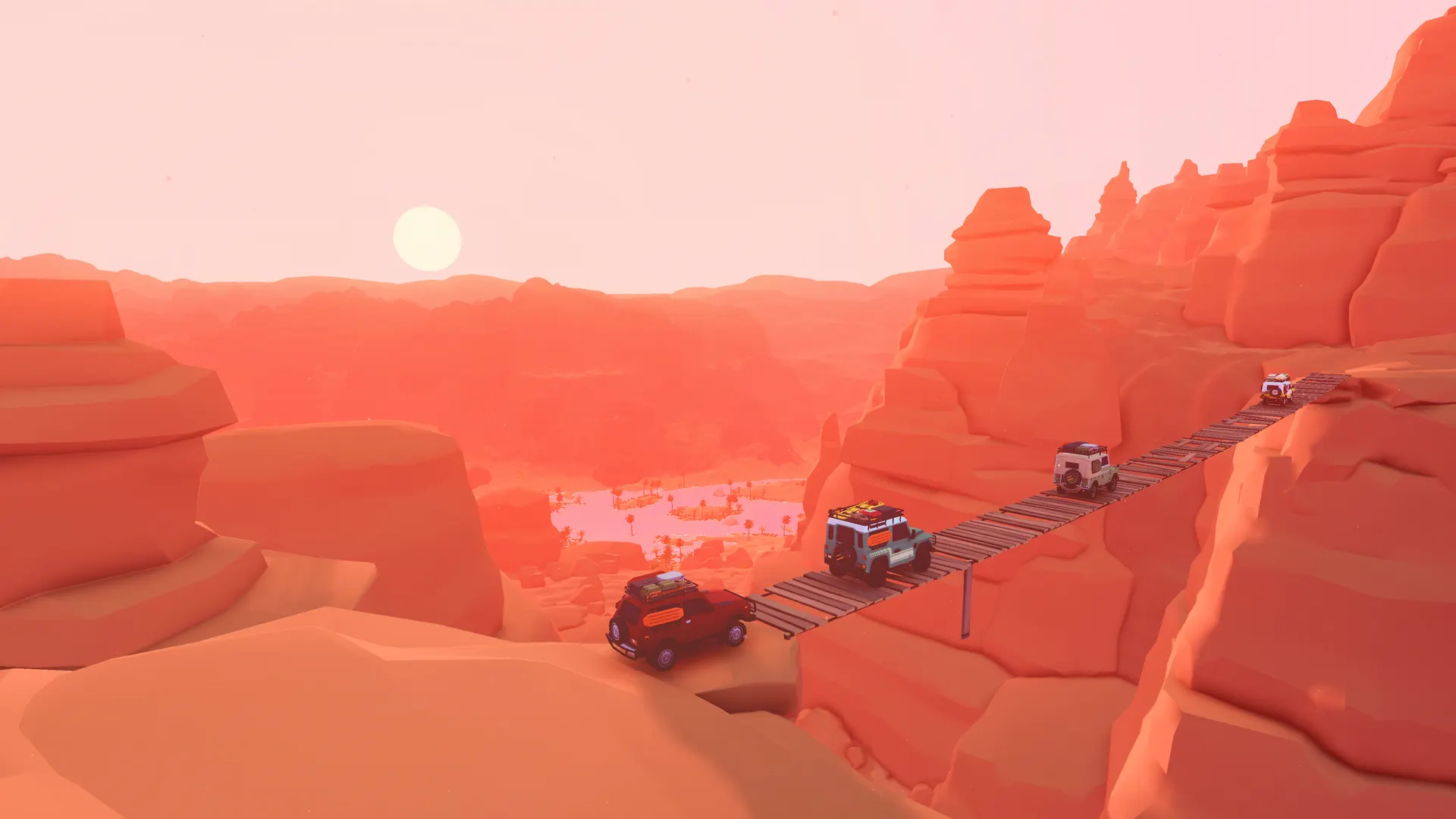 Off-road vehicles crossing a plank bridge between red canyon walls in over the hill